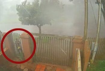PR: Homem se agarra em portão para não ser levado pelo vento durante temporal